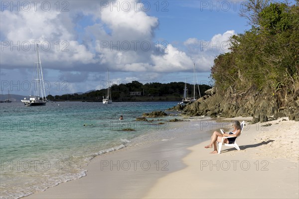 Hispanic woman relaxing on tropical beach