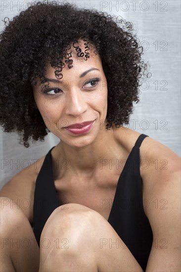 Close up of smiling Mixed Race woman
