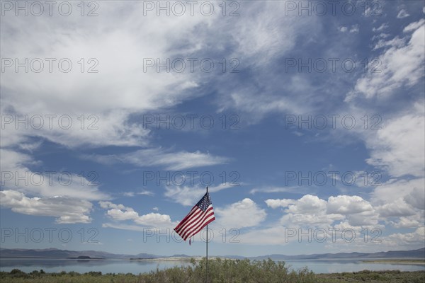 American flag under cloudy sky