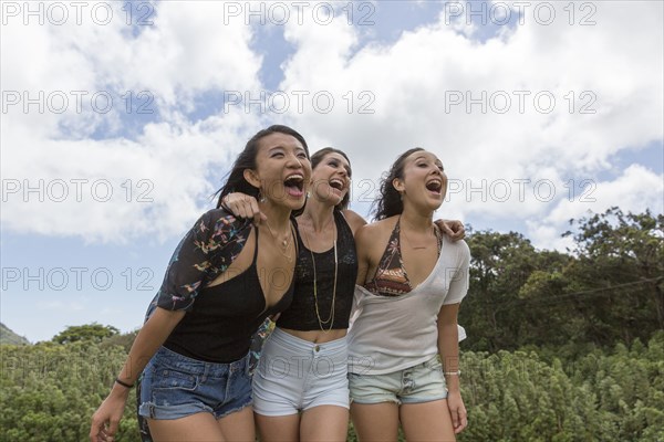 Friends hugging and laughing