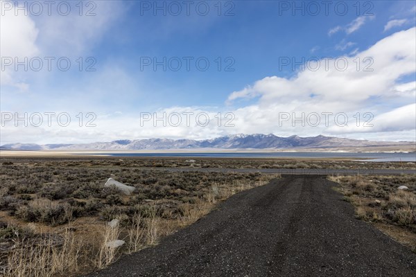 Gravel road and distant mountain range