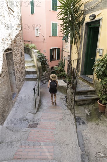 Caucasian woman descending outdoors staircase