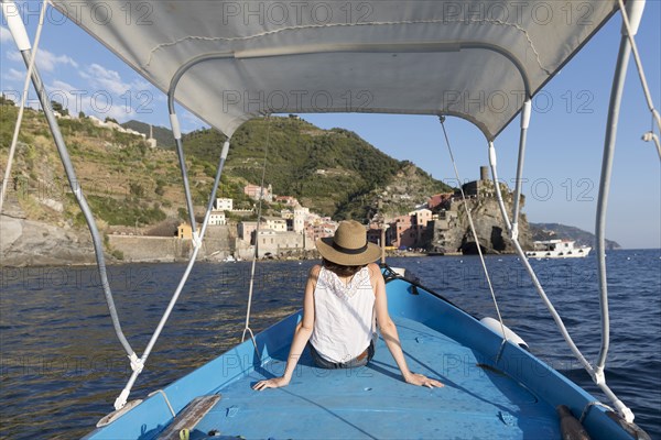 Caucasian woman relaxing on boat