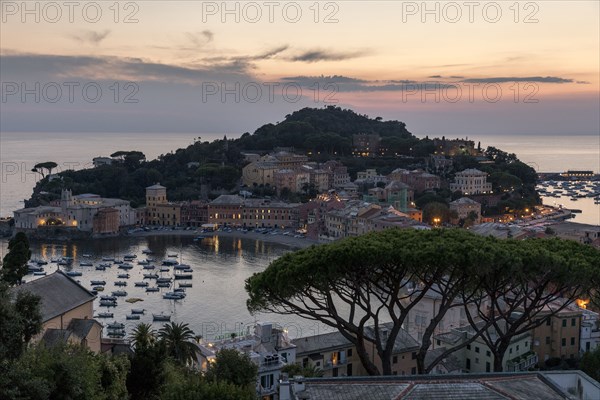 Scenic view of harbor at sunset