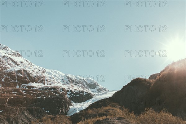 Sunbeams on snowy mountain