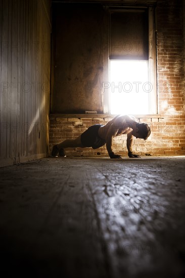 Caucasian man doing push-ups