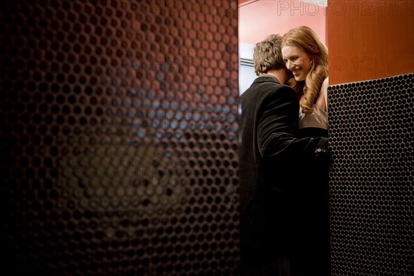 Couple kissing in bathroom