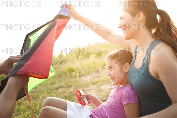 Family preparing to fly kite