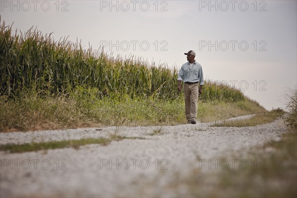 African American man walking on remote path