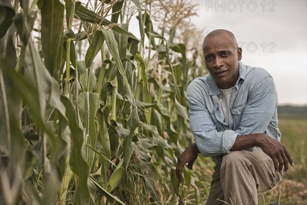 African American farmer tending crops