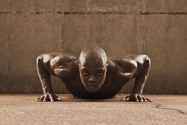 African American man doing push-ups