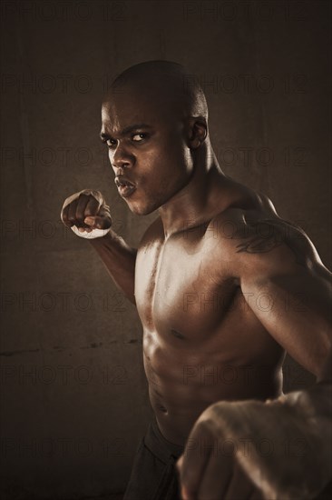 African American boxer preparing to punch