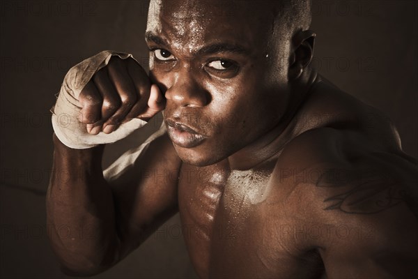 African American boxer preparing to punch