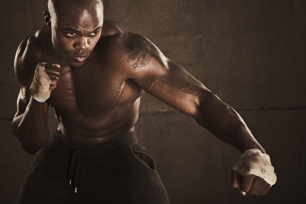 African American boxer preparing to punch