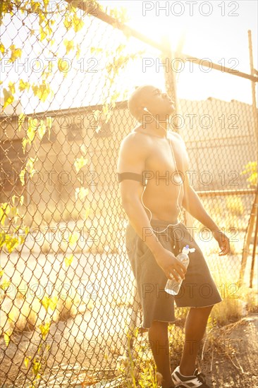 African American man relaxing after exercise