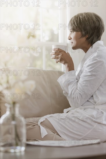 Native American woman drinking coffee