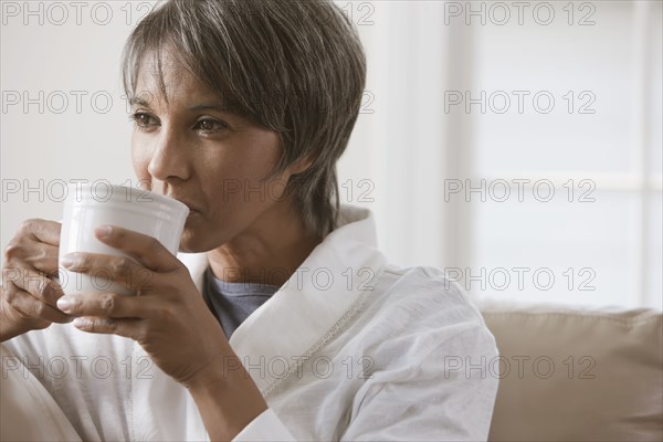 Native American woman drinking coffee