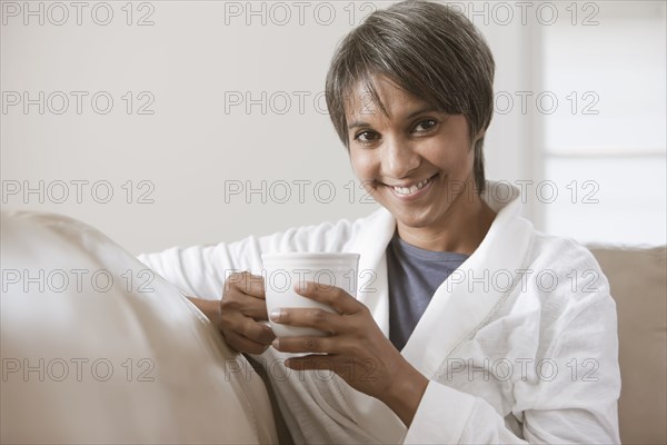 Native American woman drinking coffee