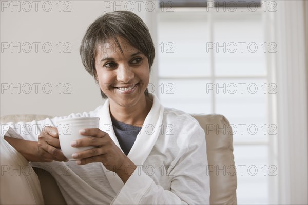 Native American woman drinking coffee