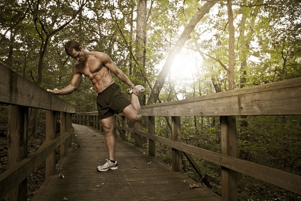 Caucasian man stretching before exercise