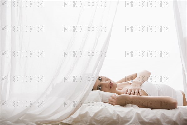 Caucasian woman laying in bed