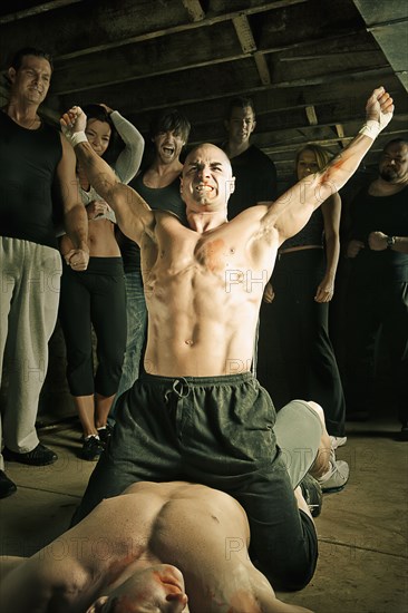 Boxer cheering after beating opponent