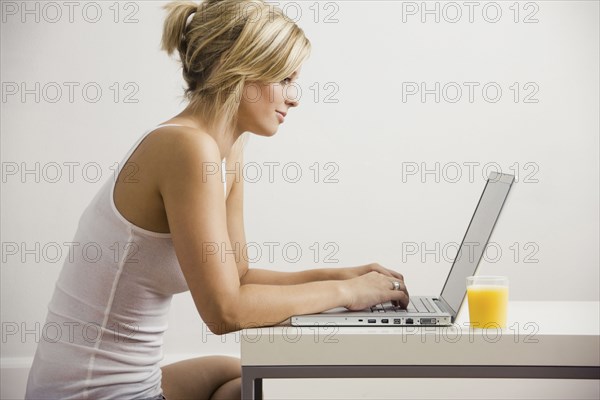 Caucasian woman using laptop