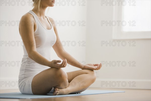 Caucasian woman practicing yoga