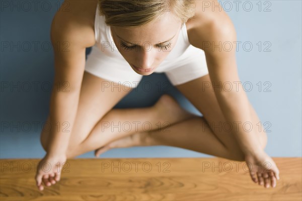 Caucasian woman practicing yoga