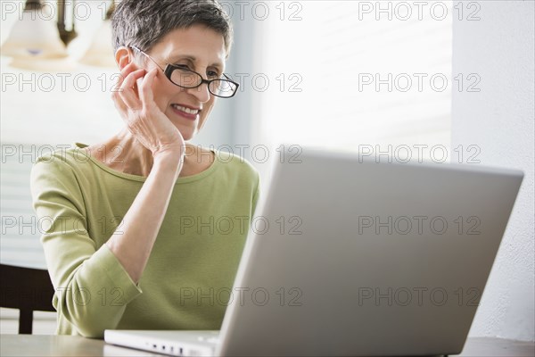 Senior woman using laptop