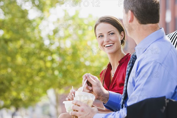 Caucasian co-workers having lunch together outdoors