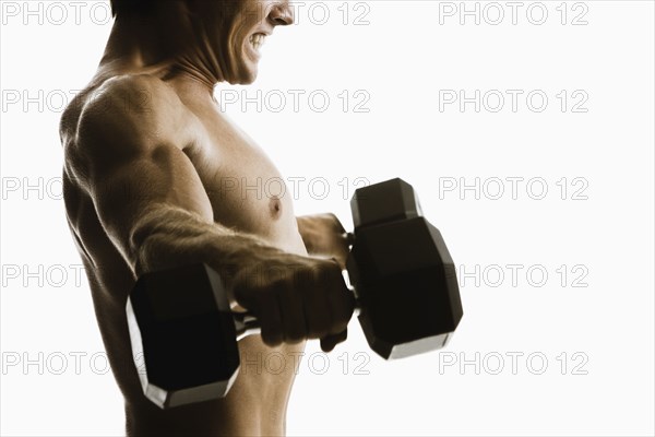 Caucasian man lifting weights