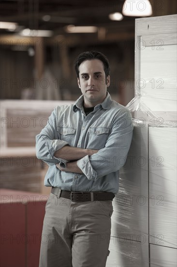 Caucasian worker standing in warehouse