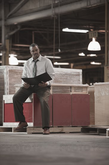 Black businessman working in warehouse