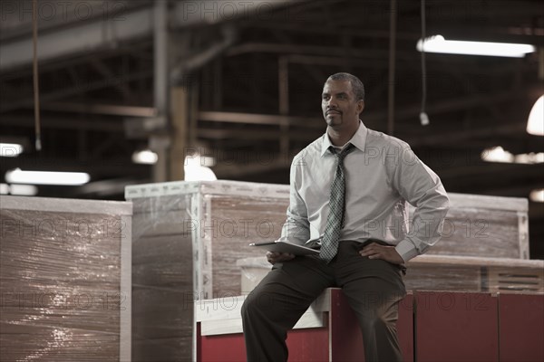 Black businessman working in warehouse