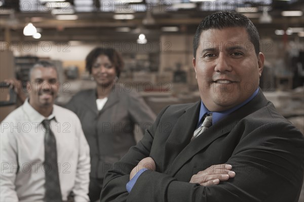 Business people standing in warehouse