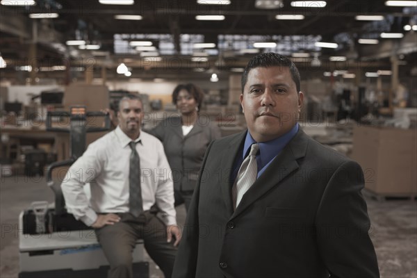 Business people standing in warehouse