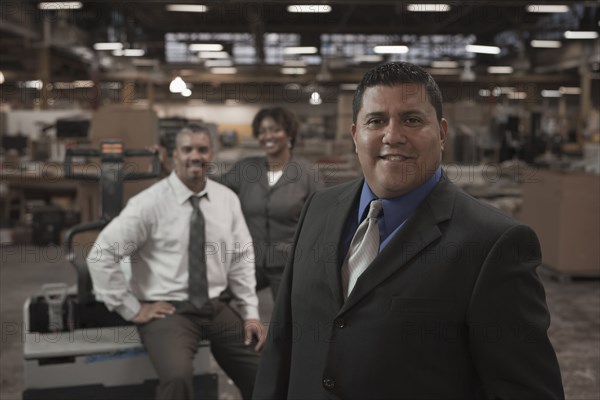 Business people standing in warehouse