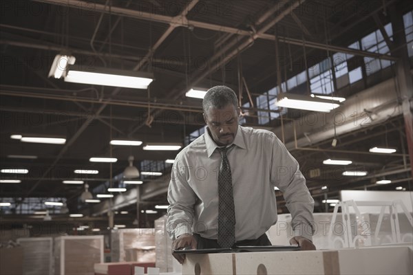 Black businessman working in warehouse