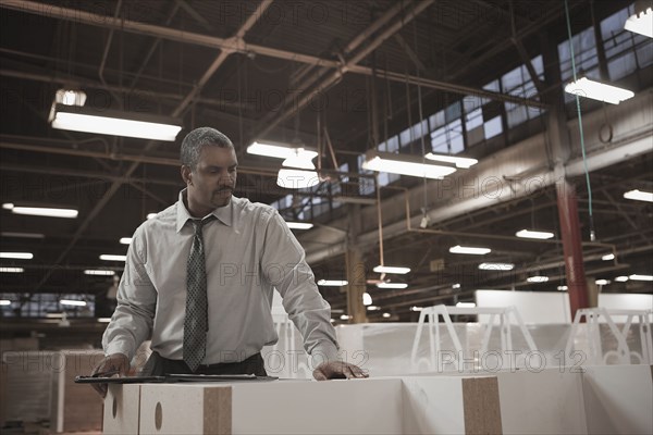 Black businessman working in warehouse