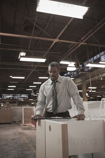 Black businessman working in warehouse