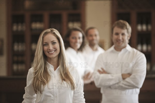 Wait staff standing in restaurant