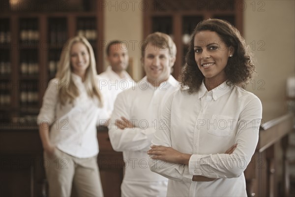 Wait staff standing in restaurant