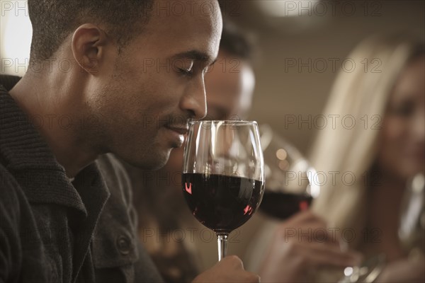 Friends tasting wine together