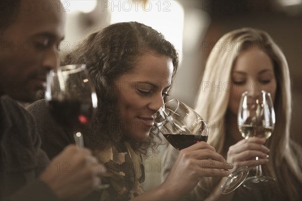 Friends tasting wine together