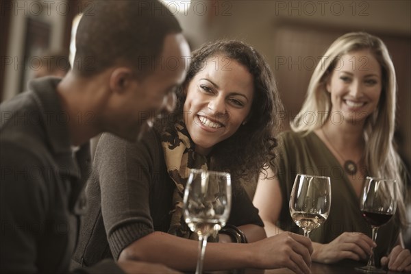 Friends drinking wine together