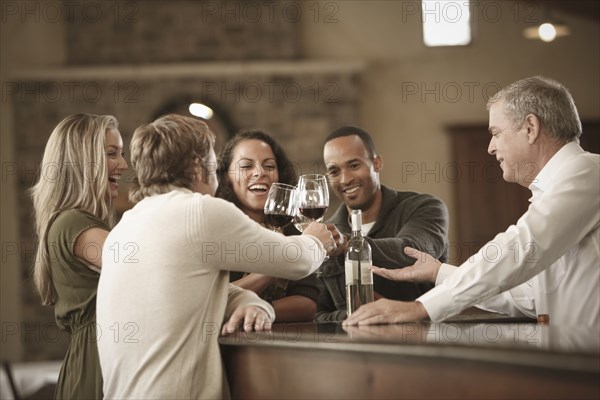 Friends drinking wine together