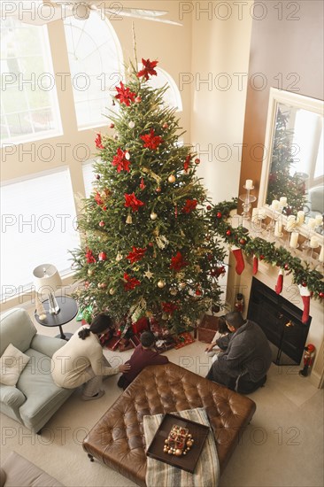 Family opening gifts Christmas morning