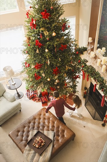 Children opening gifts Christmas morning