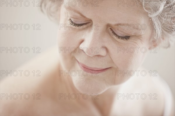 Caucasian woman with eyes closed